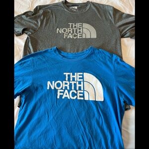 Two men’s North Face t shirts